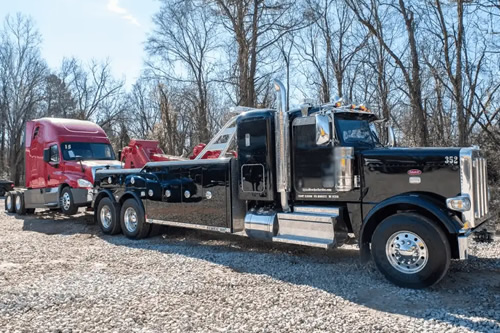 Wrecker truck assisting vehicle